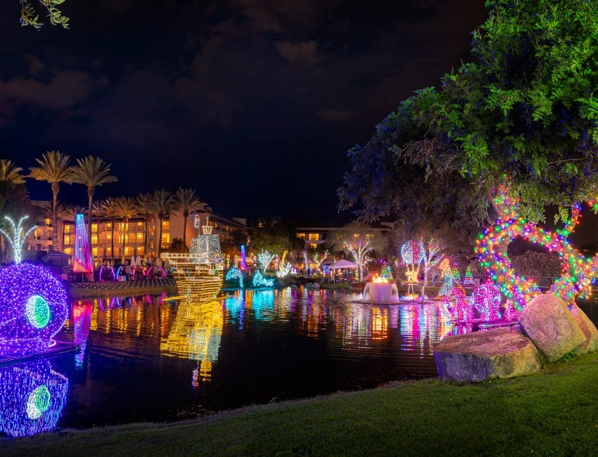 a water with lights and trees