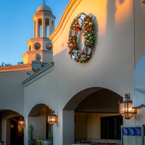 a building with a wreath on the wall