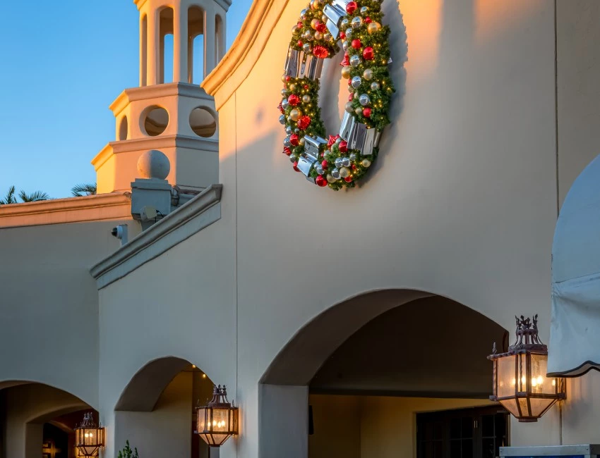 a building with a wreath on the wall