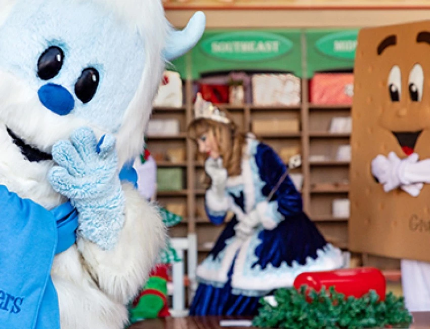 a large character in front of a mail room