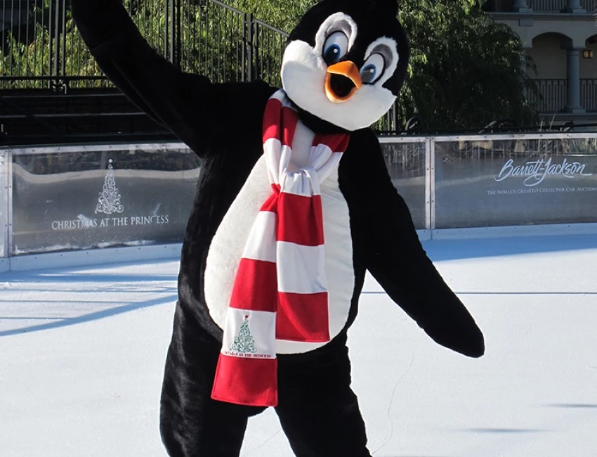 a person in a penguin costume ice skating