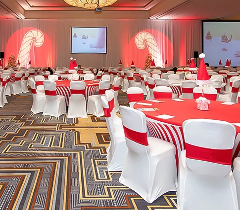 a room with red and white tables and chairs
