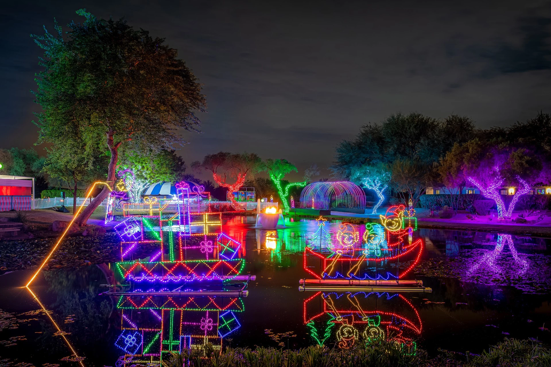a lighted boats on a body of water