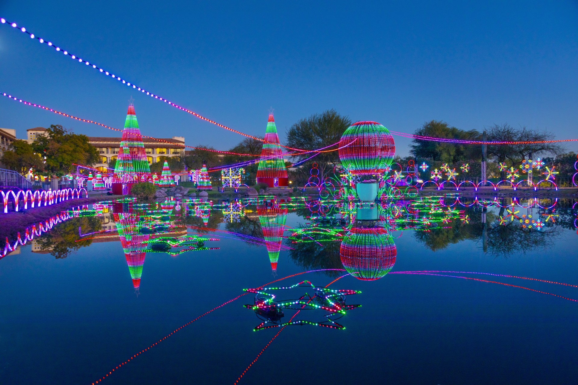 a water with lights and trees