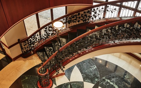 a staircase with a light on the railing main
