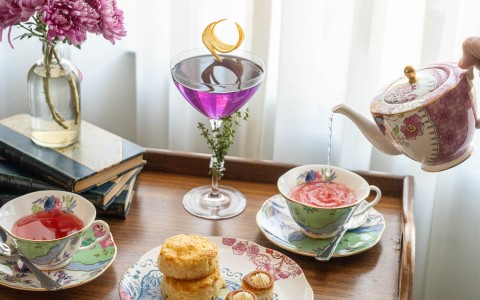 a table with a drink and food on it main