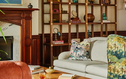 a living room with a couch and bookshelf main