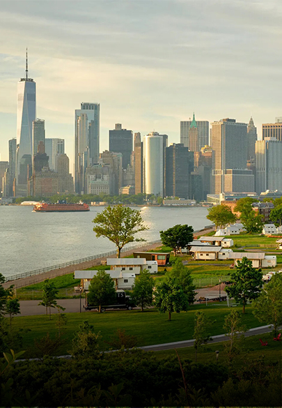 a city skyline with a body of water
