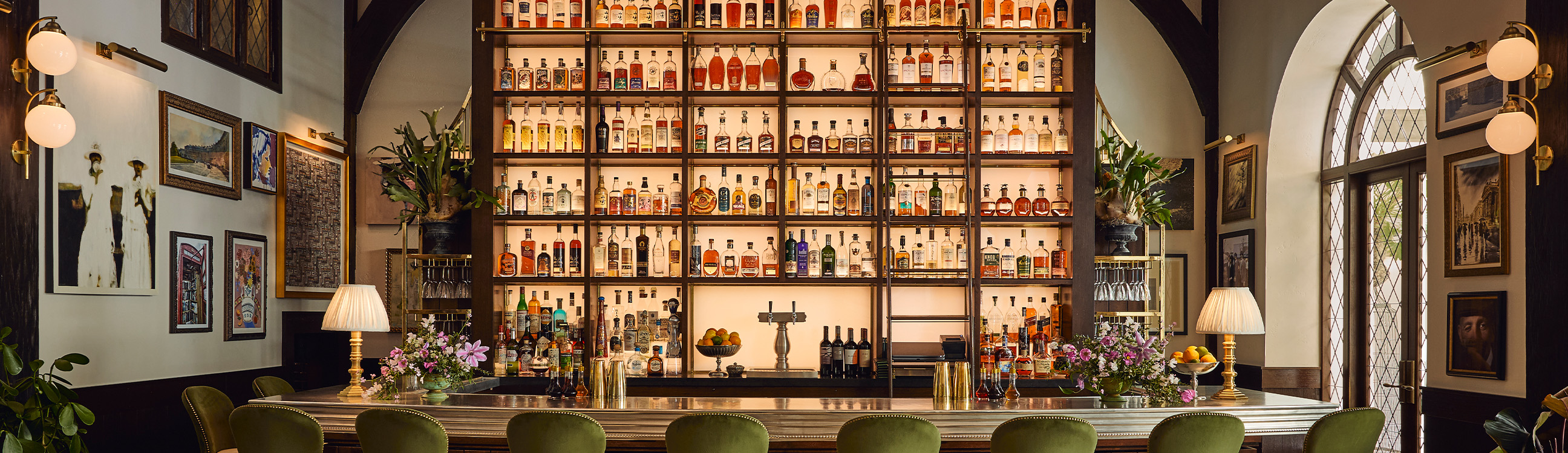 a shelf with bottles of alcohol