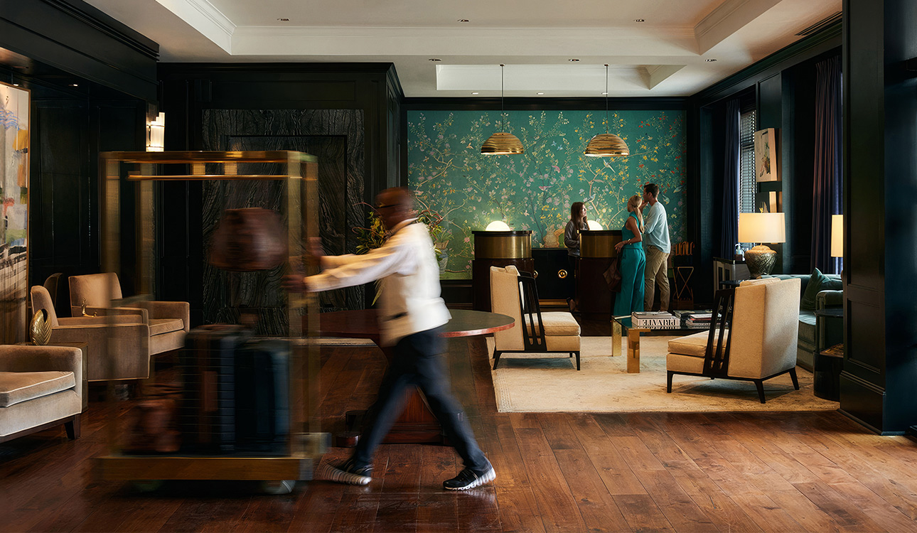 a man walking in a hotel lobby
