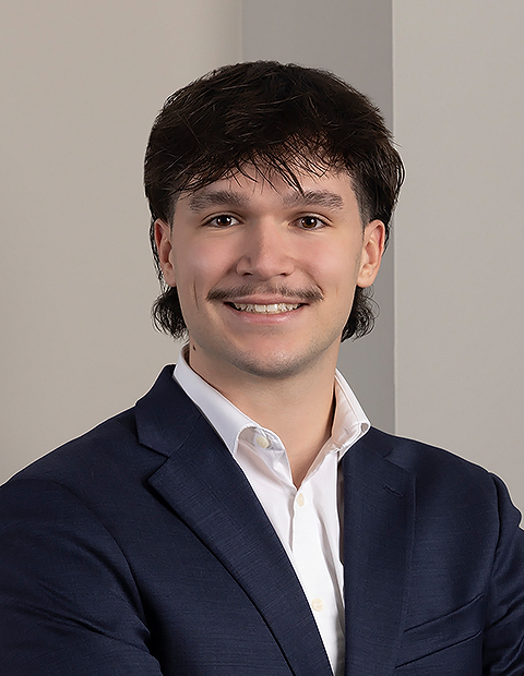 a man in a suit smiling image of Benjamin Urbaetis