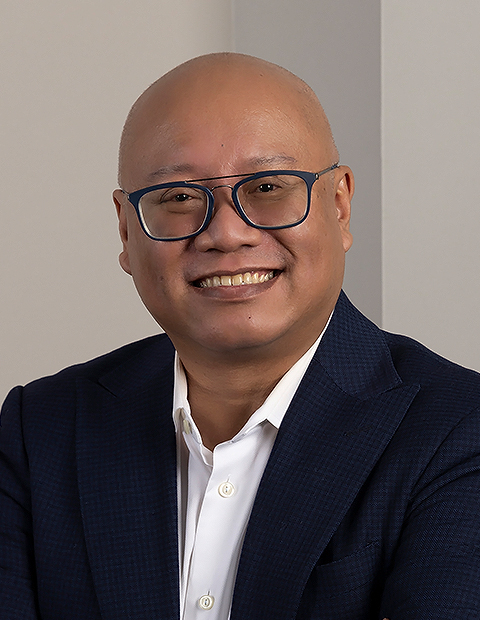 a man wearing glasses and a suit image of MarkBuot