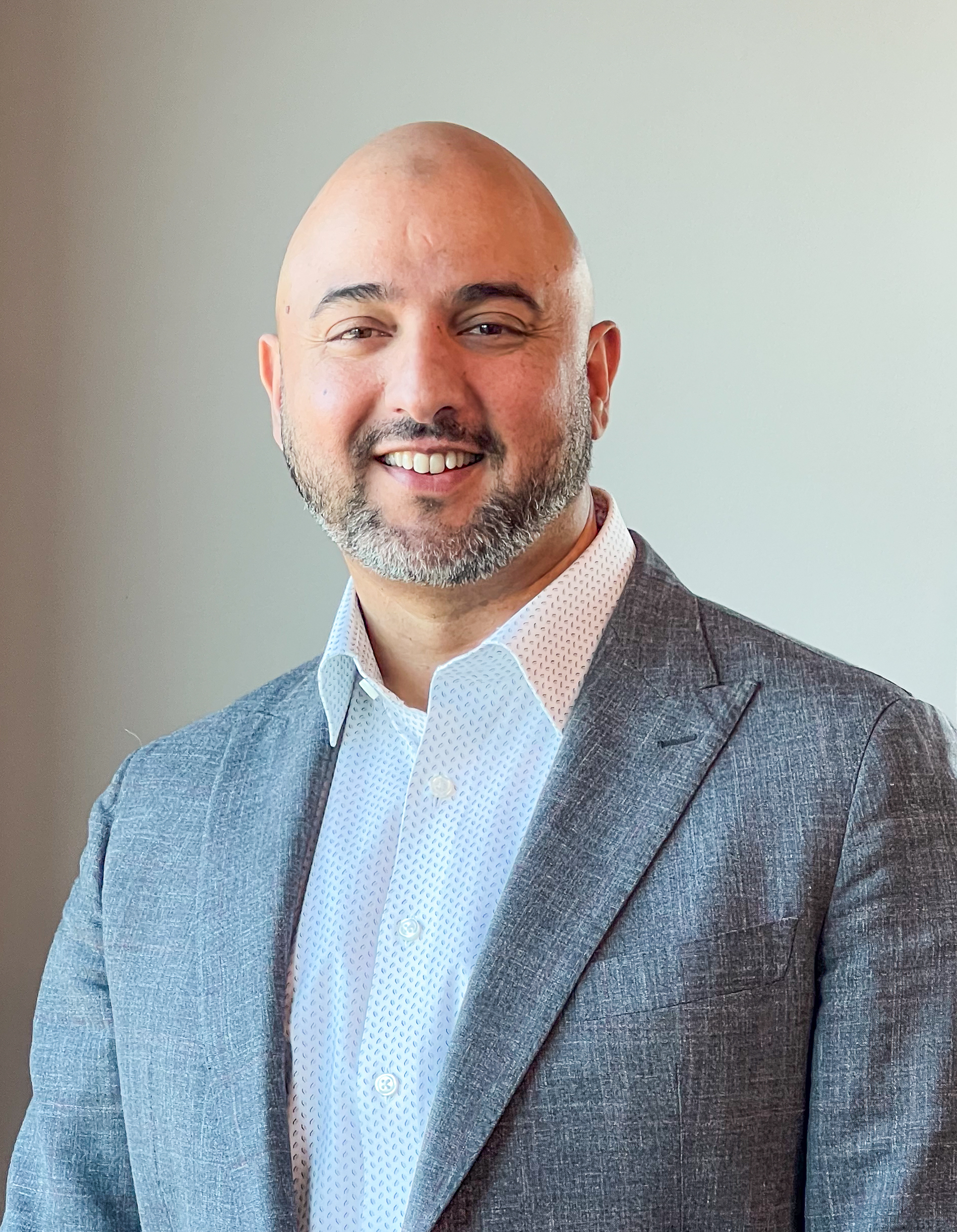 a man in a suit image of Tauseen Malik