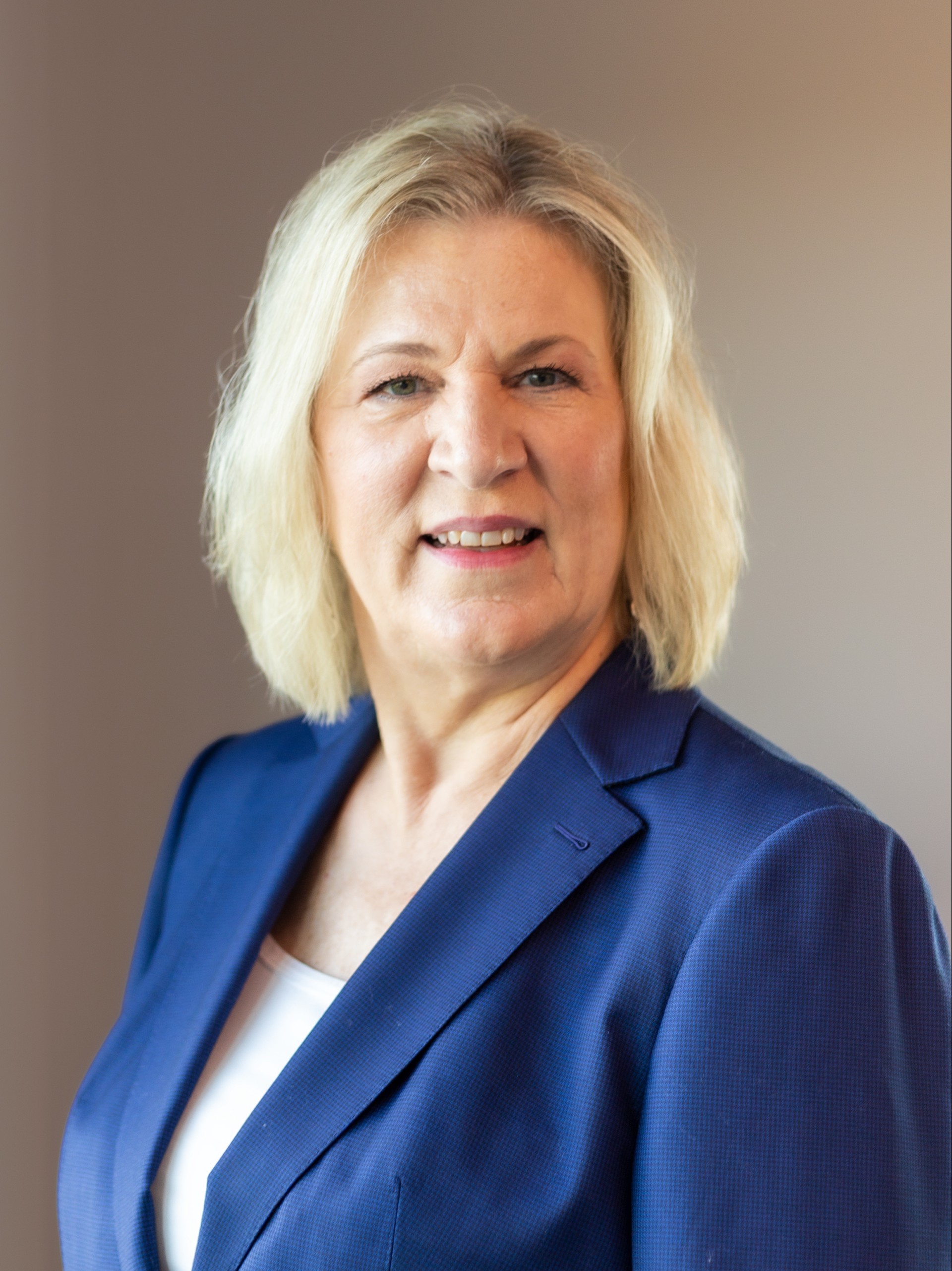 a woman in a blue suit image of Stephanie Bauer