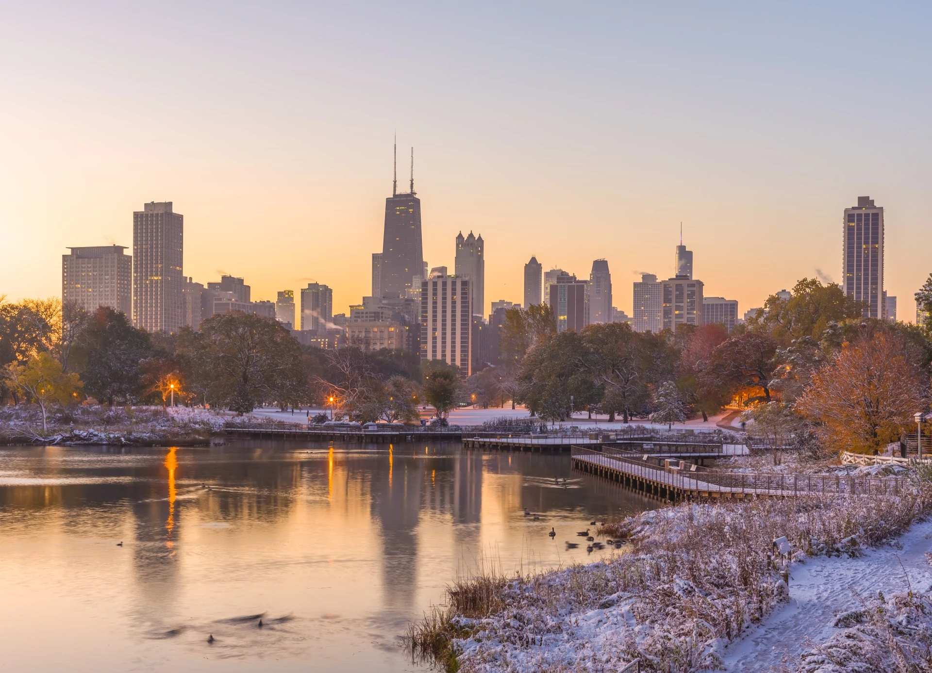 a city skyline with snow on the ground