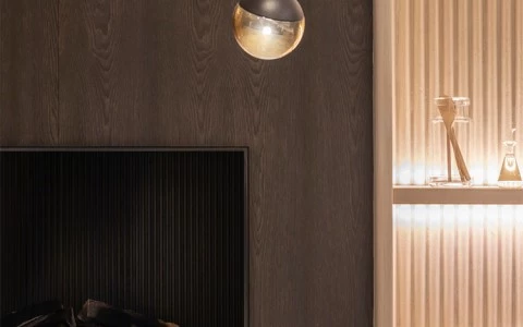 a fireplace with lamps 