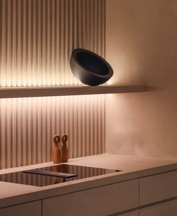 a kitchen with lights on top of the stove