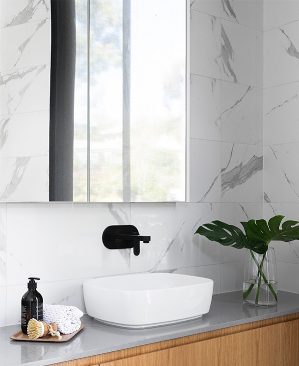bathroom with a large mirror