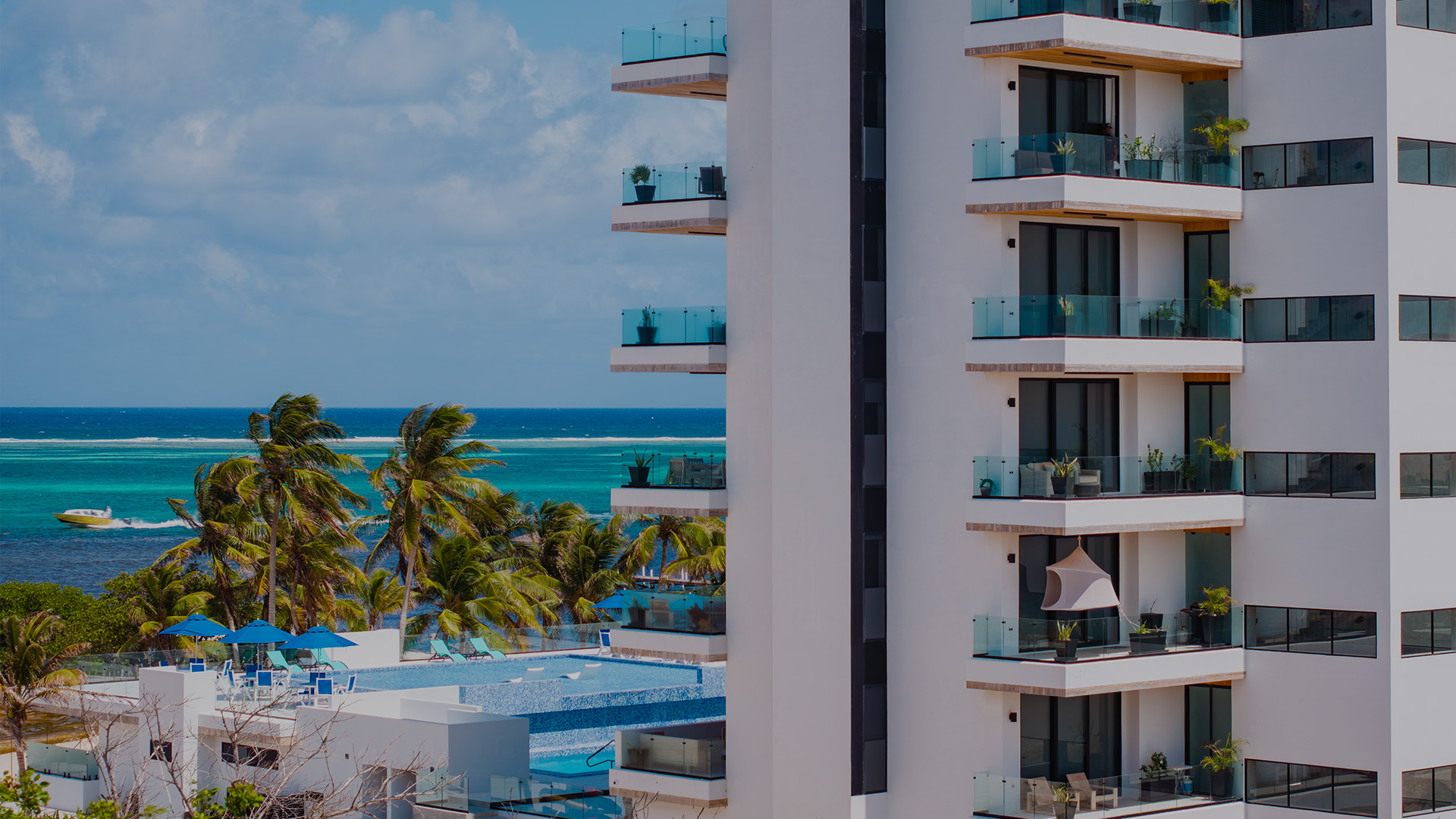 a building with balconies and a pool