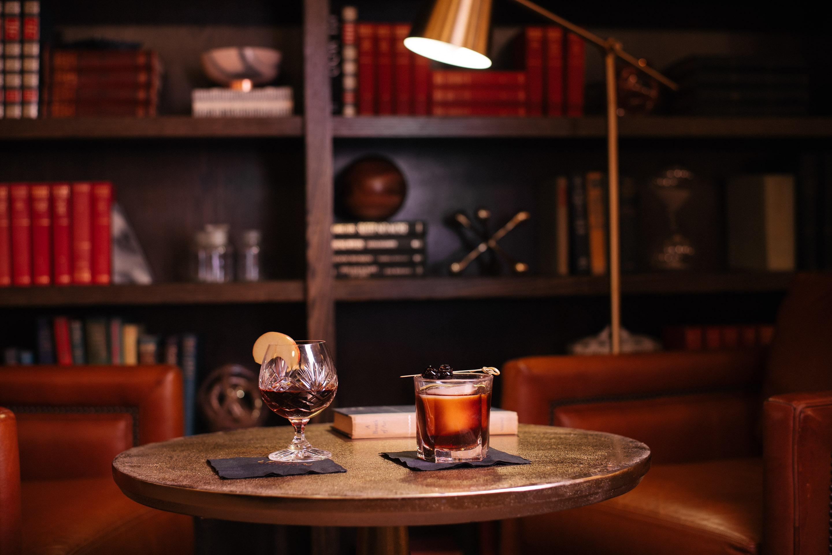 a glass of alcohol on a table