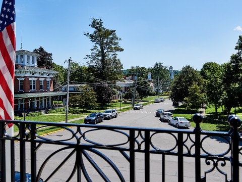a view of a street from a balcony
