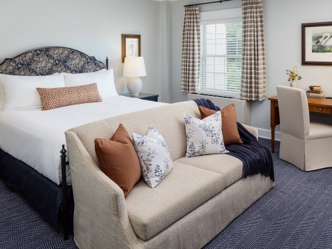 a bed and a couch in a room