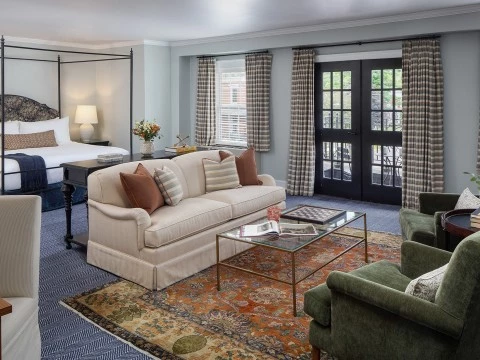 a room with a bed and couches