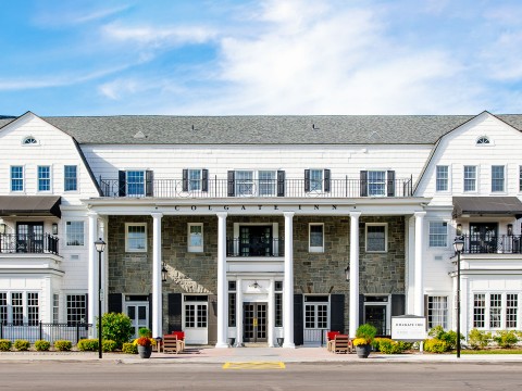 a building with columns and a street corner