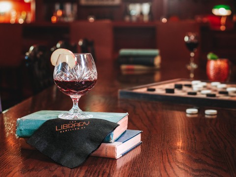 a glass of wine on a table