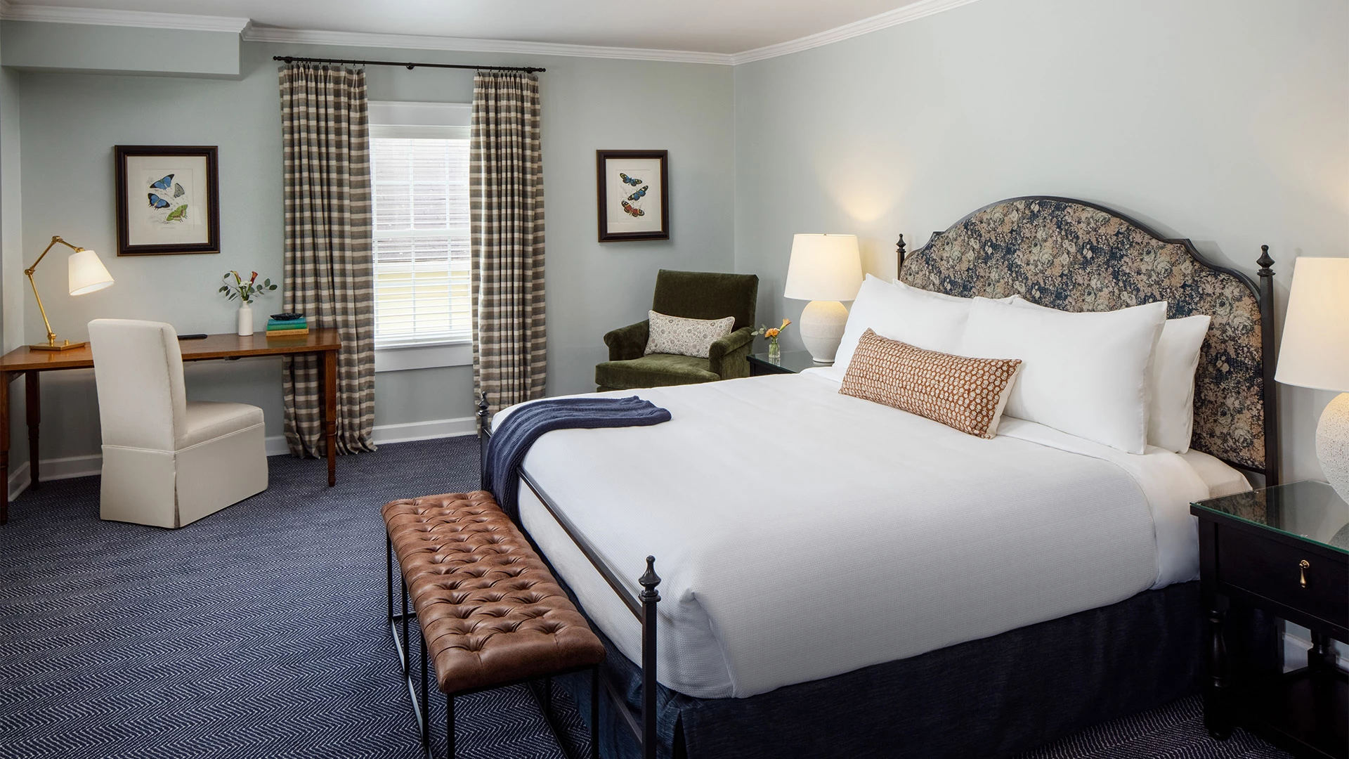 a bedroom with a bed and a chair