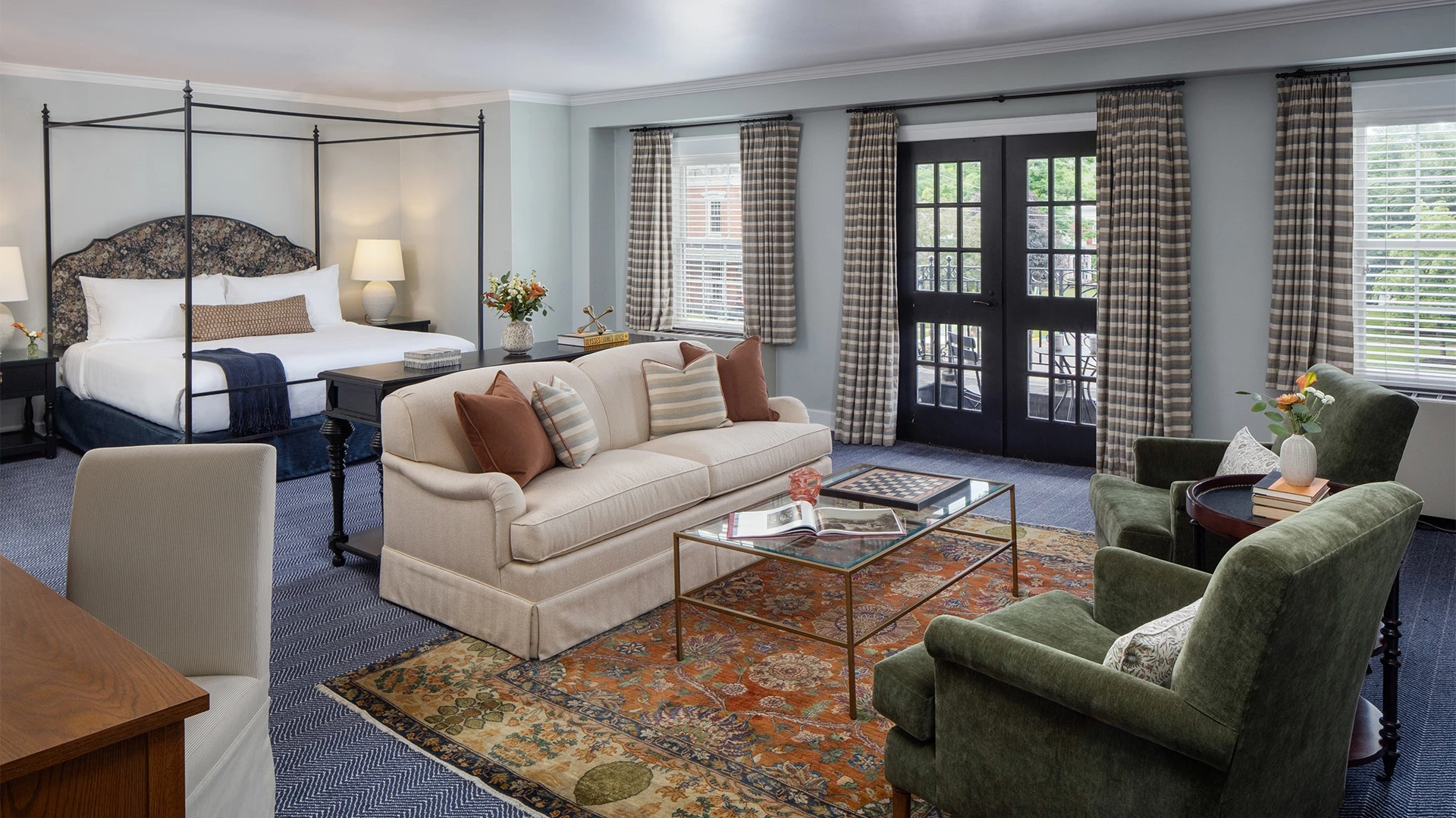 a room with a bed and couches