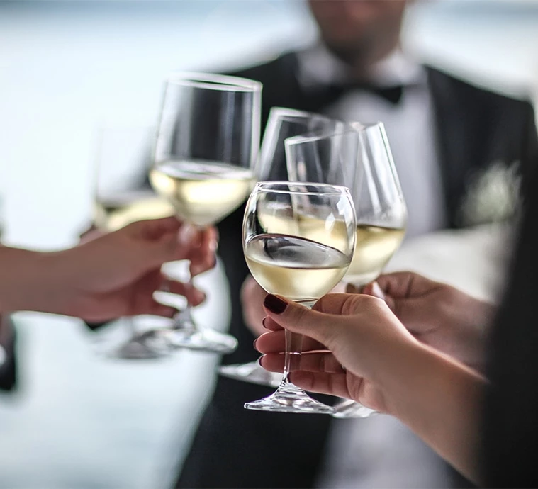 a group of people holding wine glasses