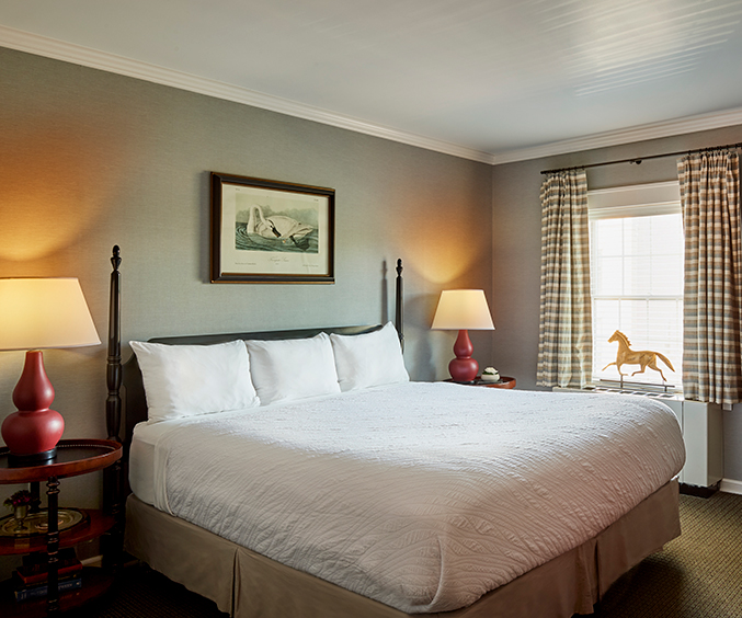 a bed with a horse on the side of it