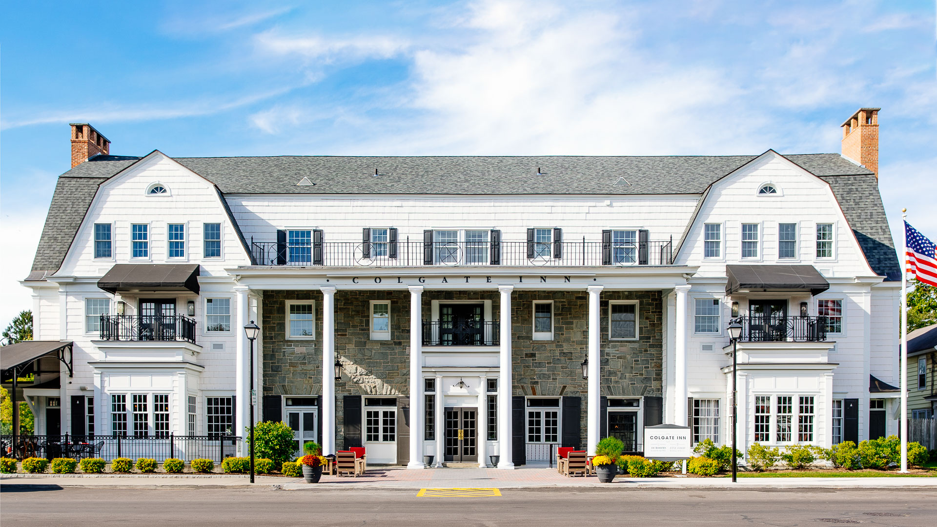 a building with columns and a street corner