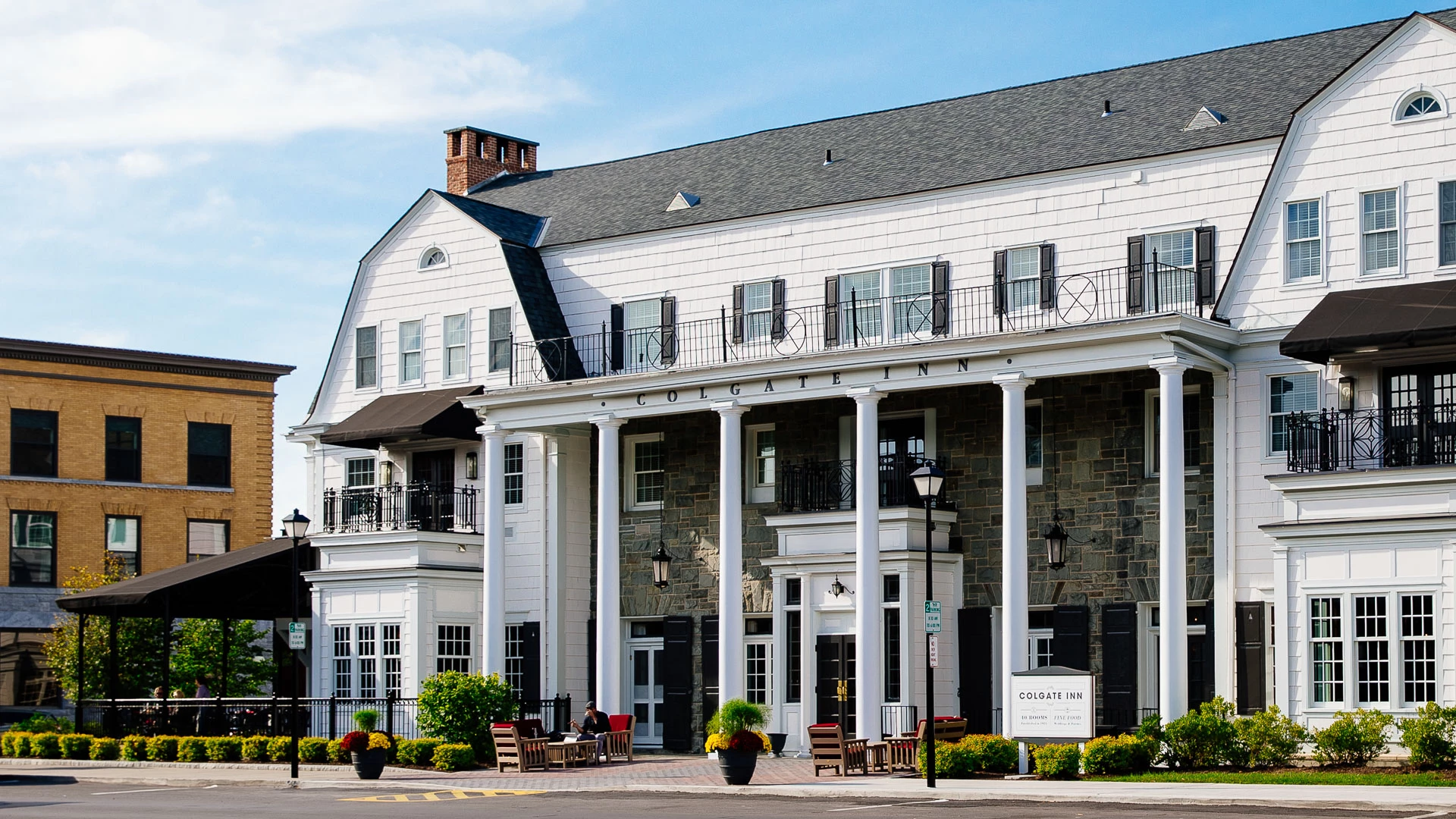a building with columns and a street corner