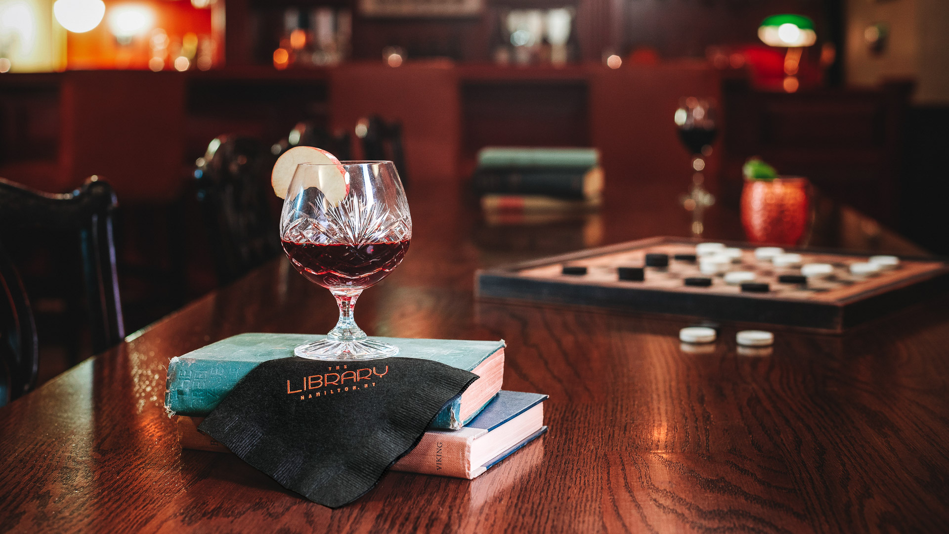 a glass of wine on a table