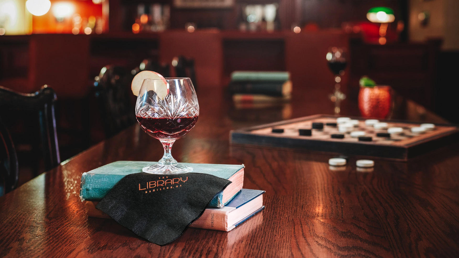 a glass of wine on a table