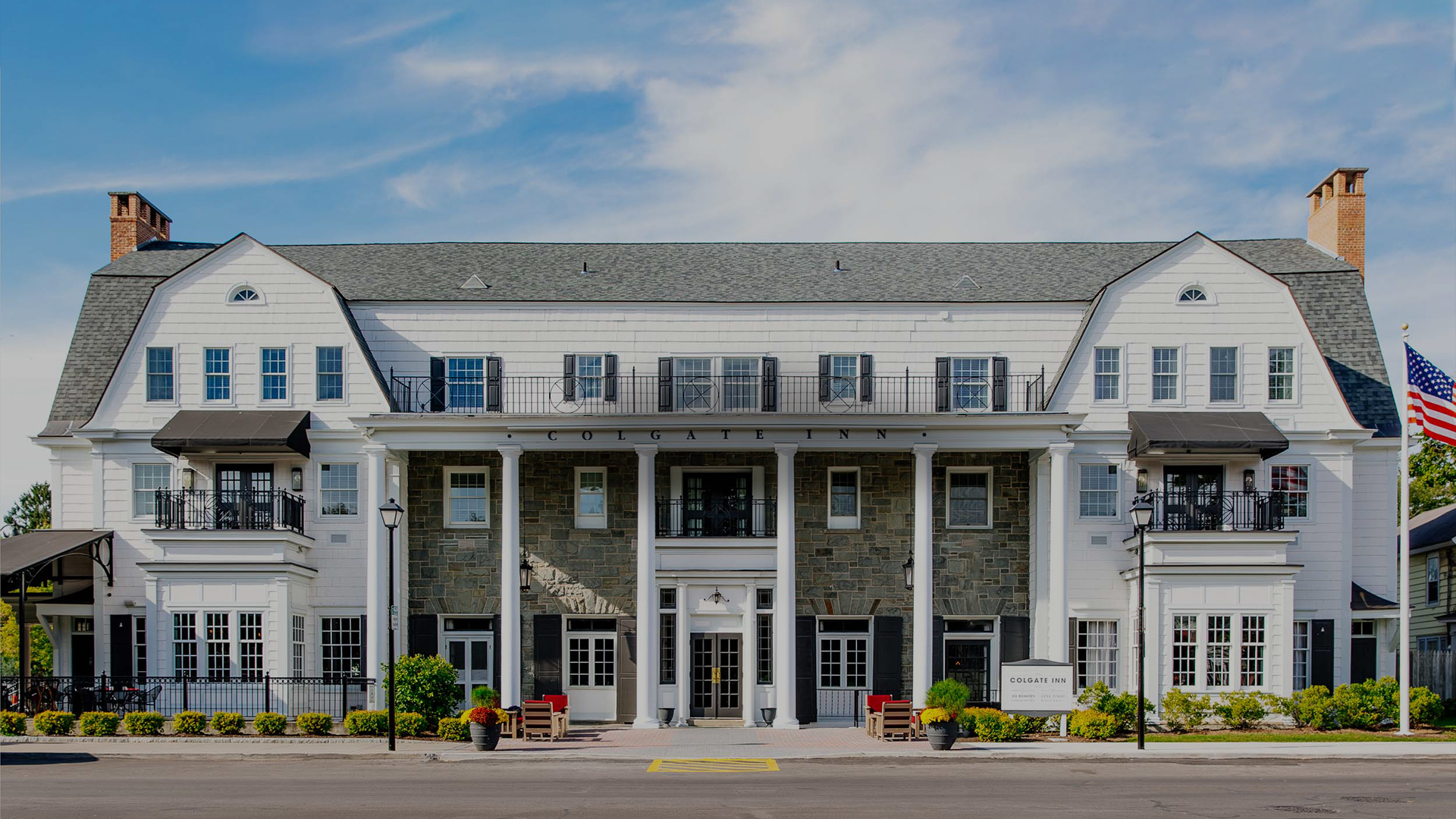 a building with columns and a street corner