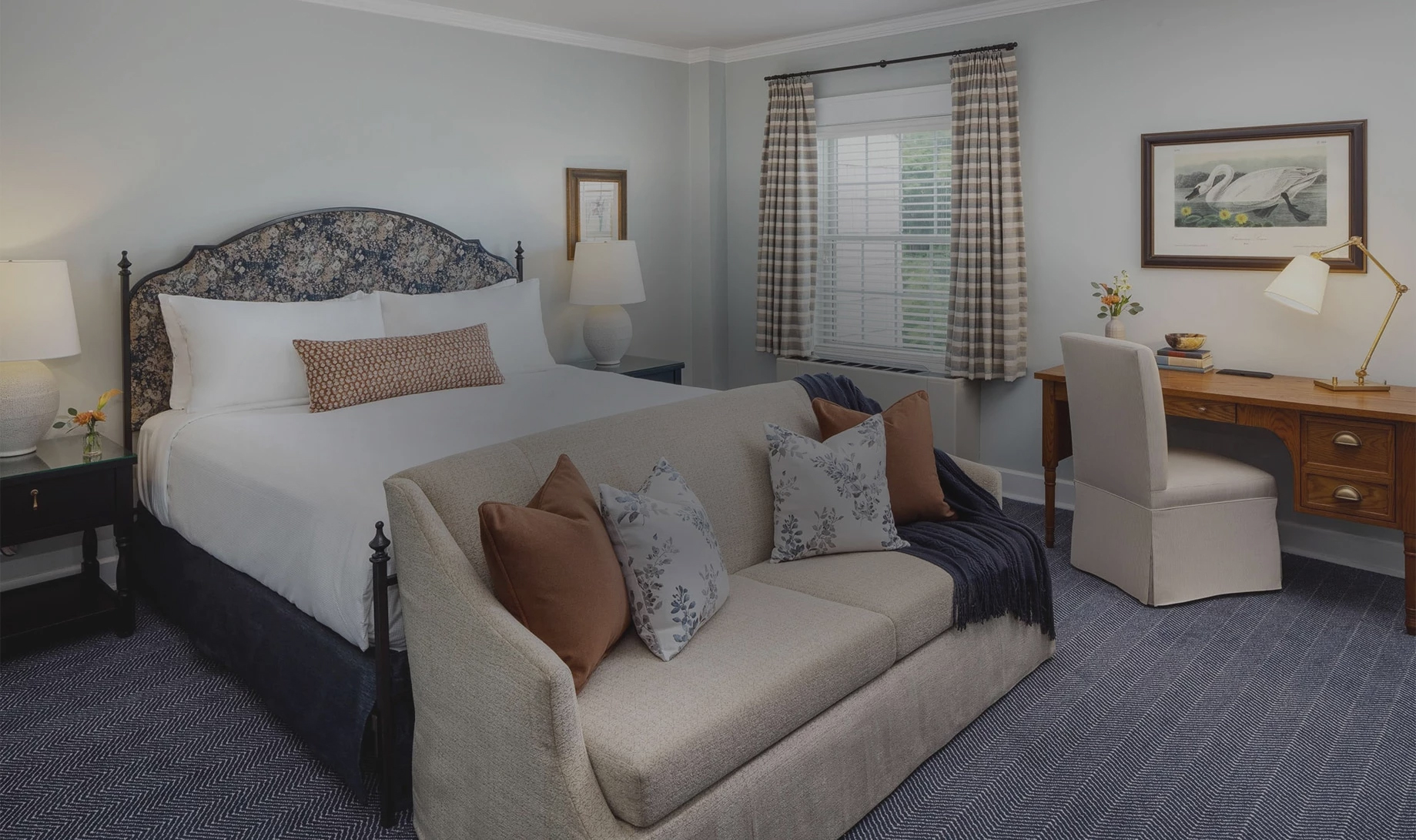 a bed with pillows in a room