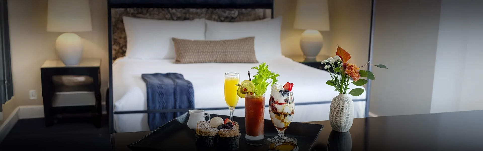 a tray of food on a bed
