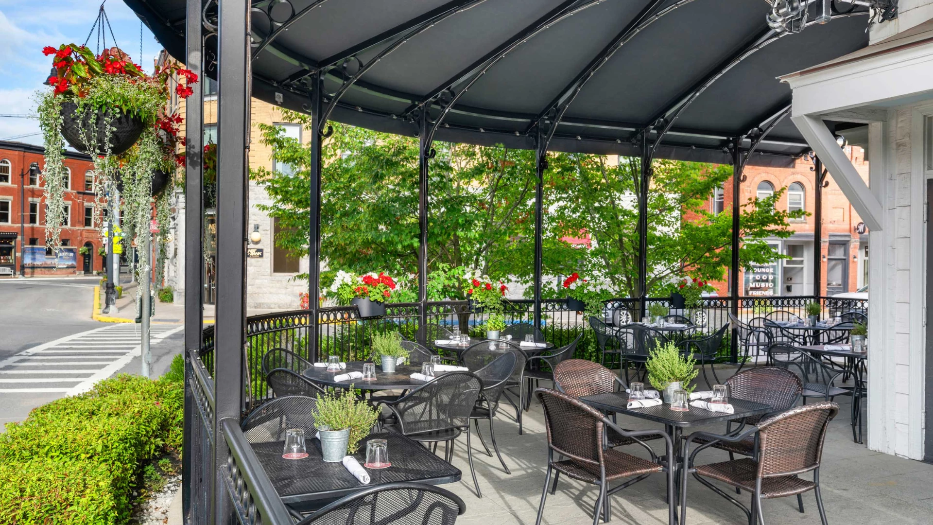 a patio with tables and chairs