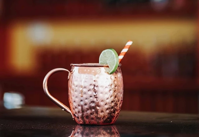a drink in a copper cup