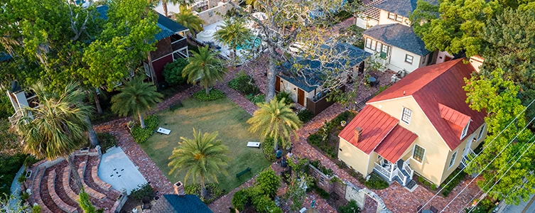 a group of houses with trees and grass