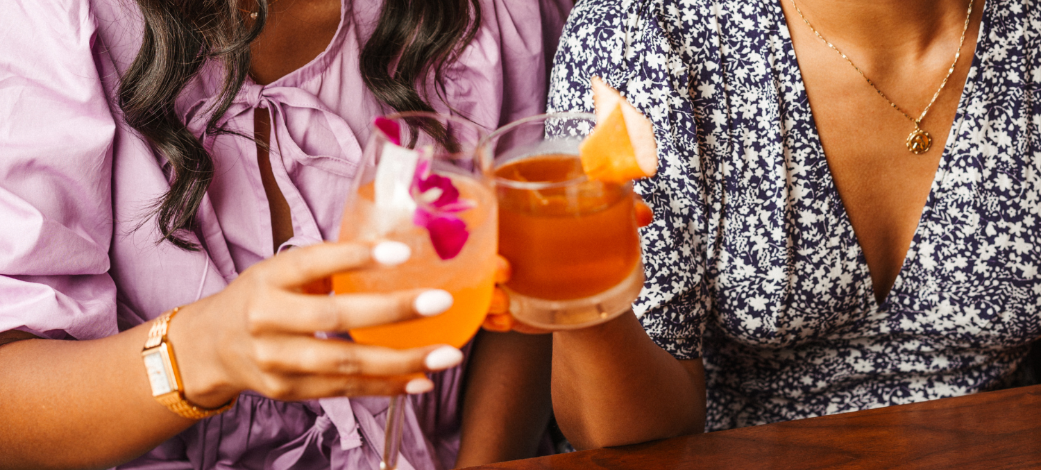 a group of people holding drinks