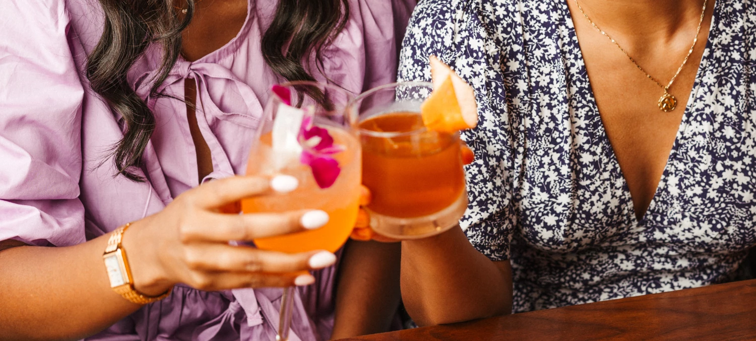 a group of people holding drinks