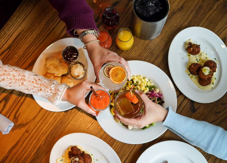 a group of people holding drinks