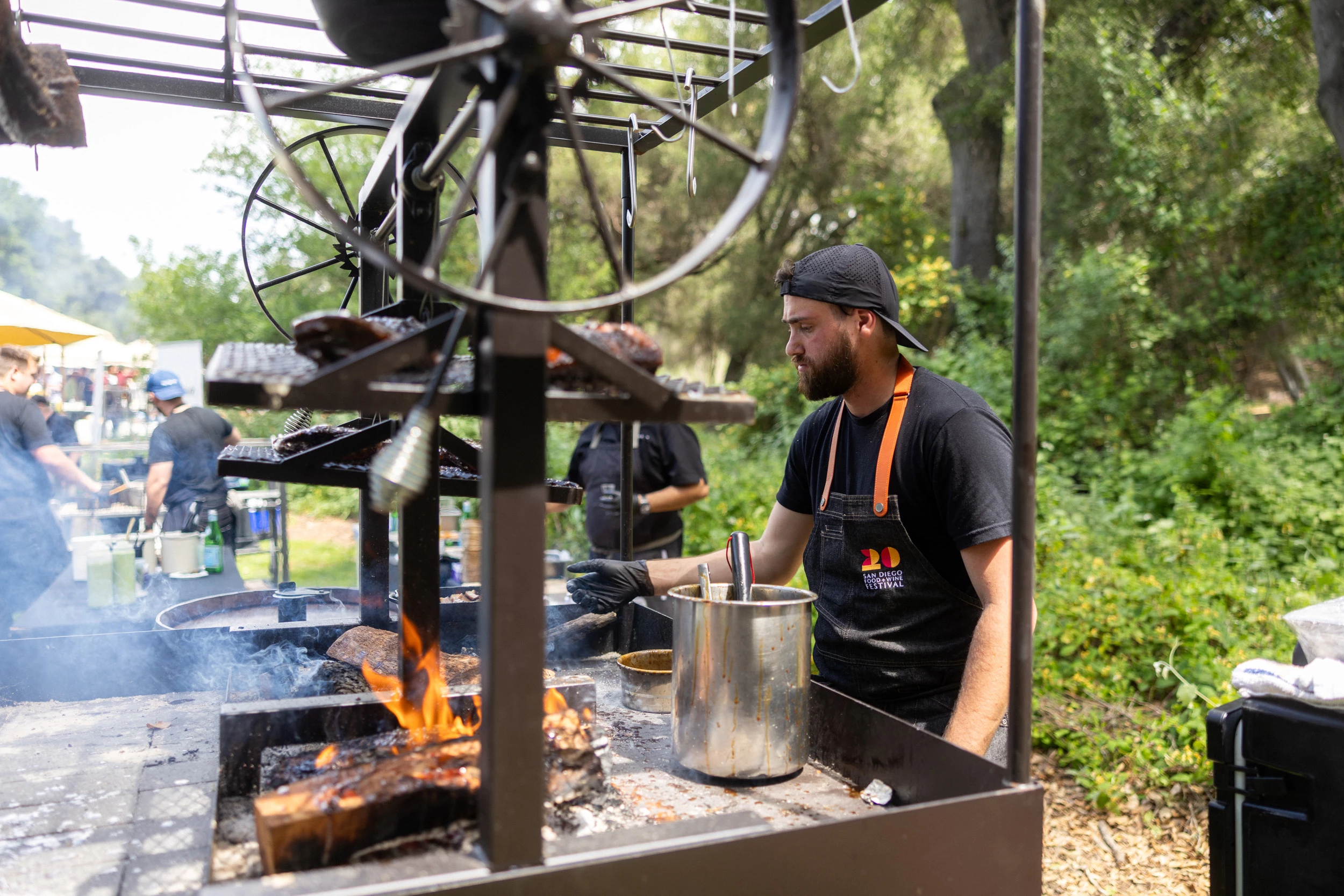 a man cooking on a grill