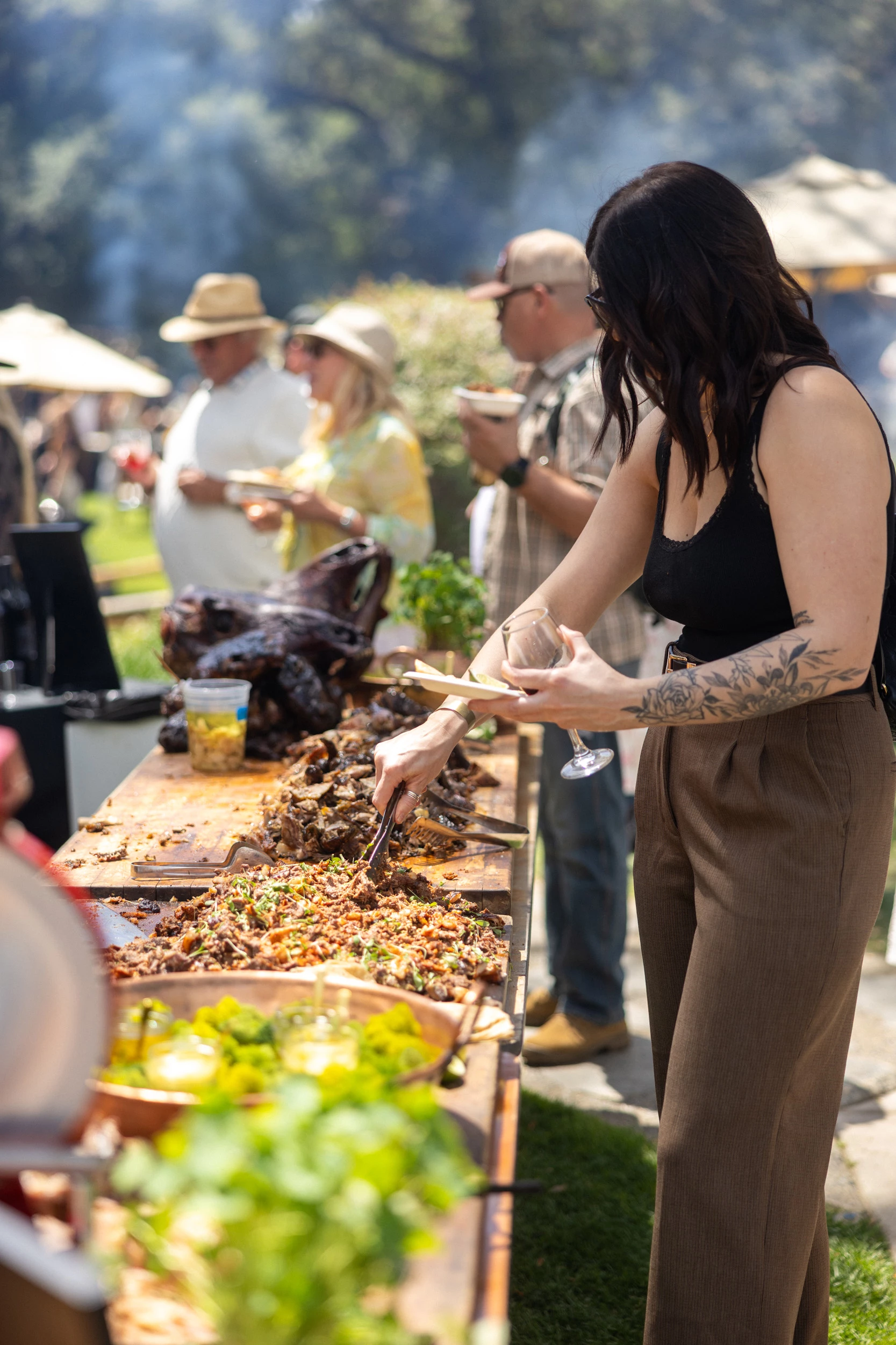 a woman serving food at a buffet