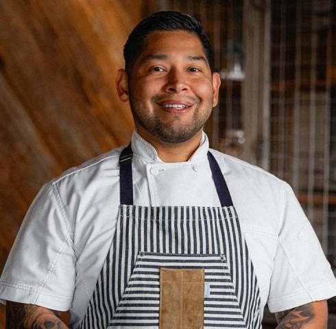 a man wearing a striped apron
