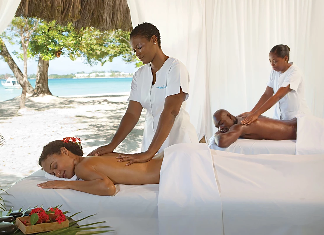 a woman receiving a massage from a man